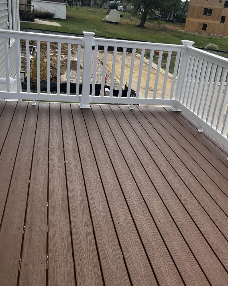 A new composite deck with a white railing