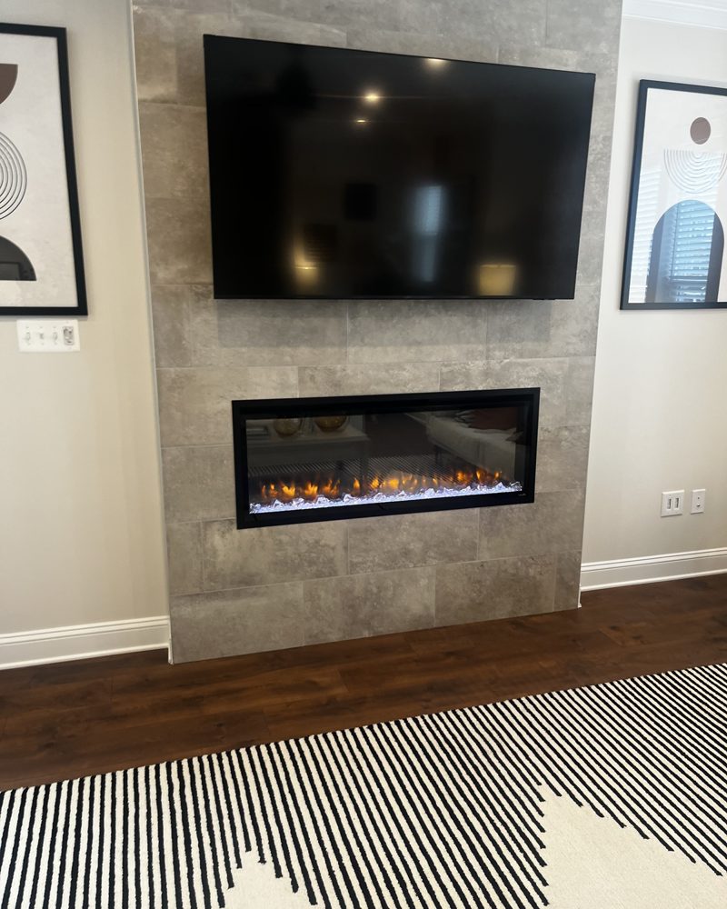 A tiled fireplace wall in a new townhome living room